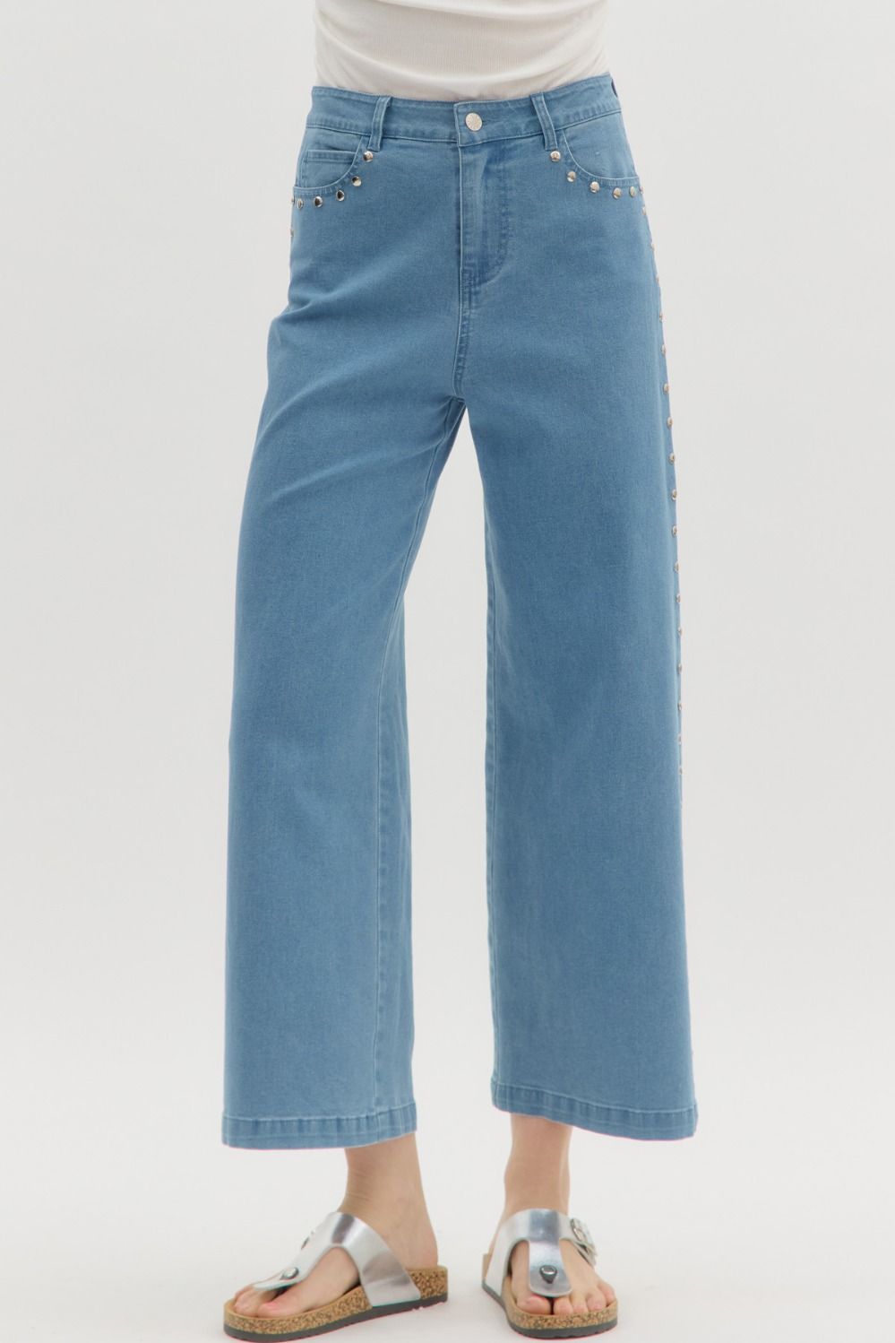 Solid high waist ankle-length pants featuring silver accented stud embellishments