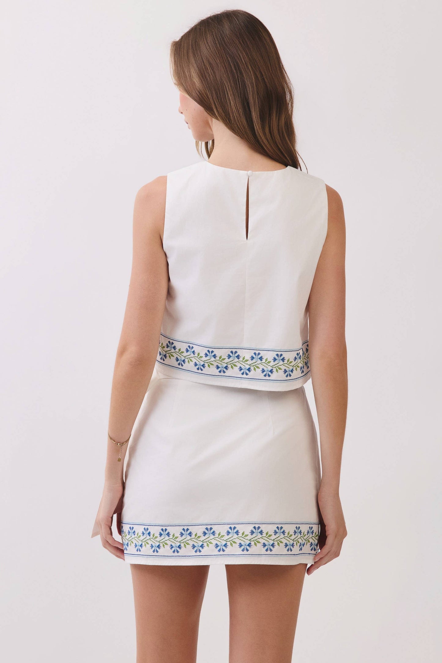 Floral Embroidered Hem Sleeveless Crop Top: White