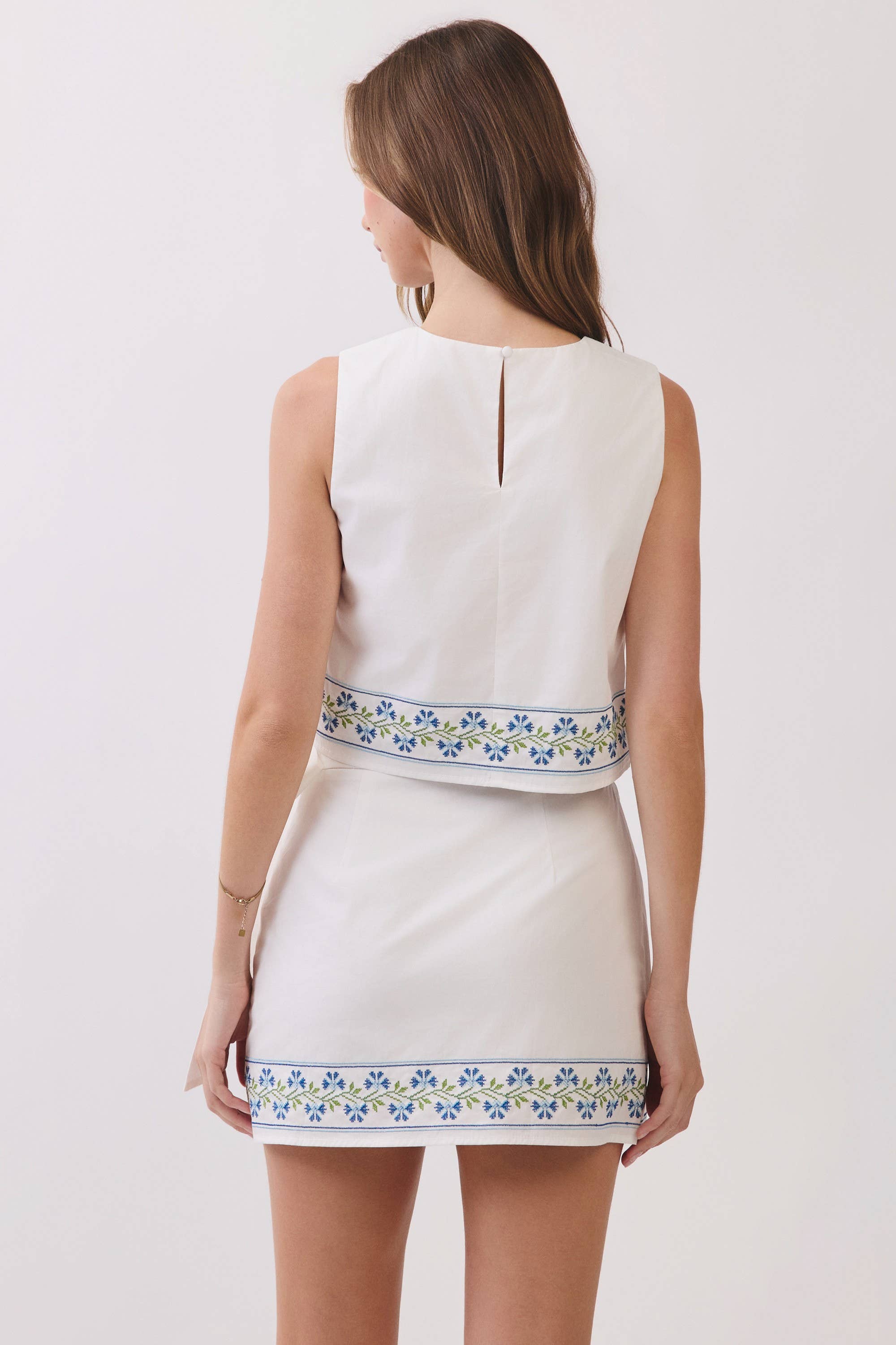 Floral Embroidered Hem Sleeveless Crop Top: White
