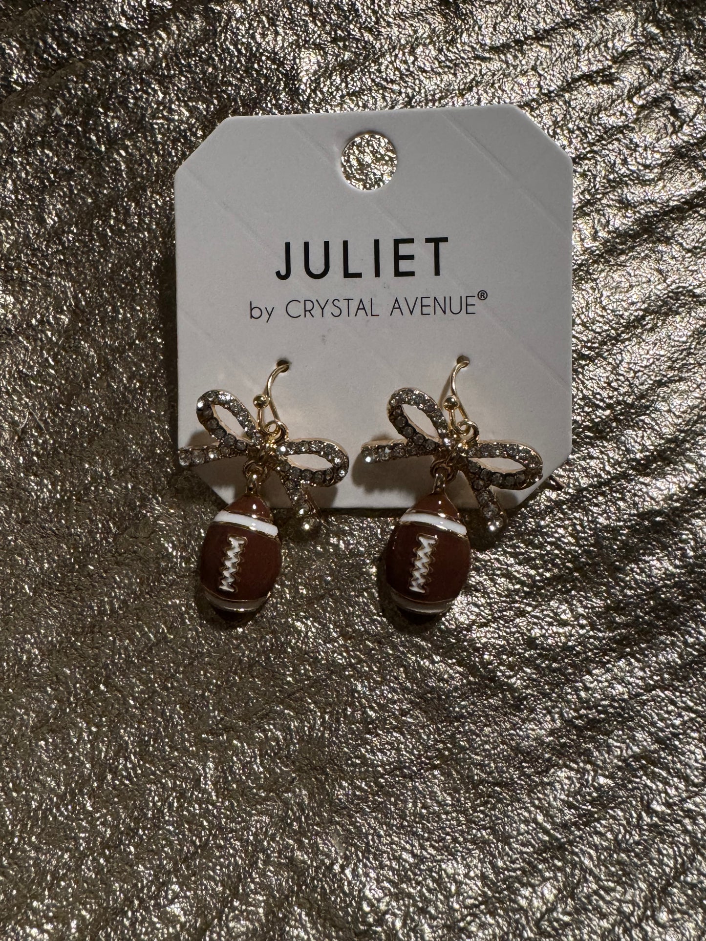 Football with silver bow earring