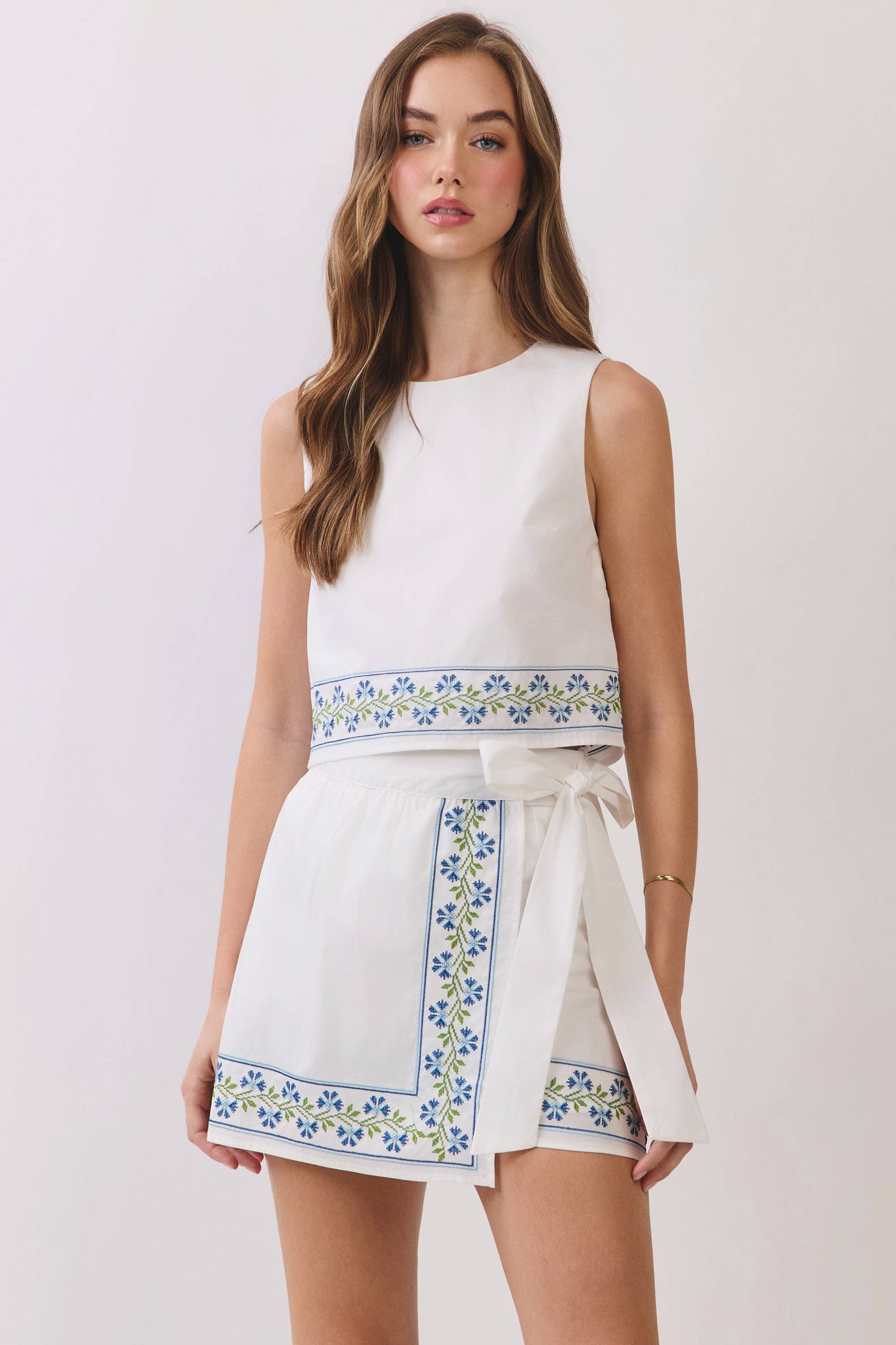 Floral Embroidered Hem Sleeveless Crop Top: White