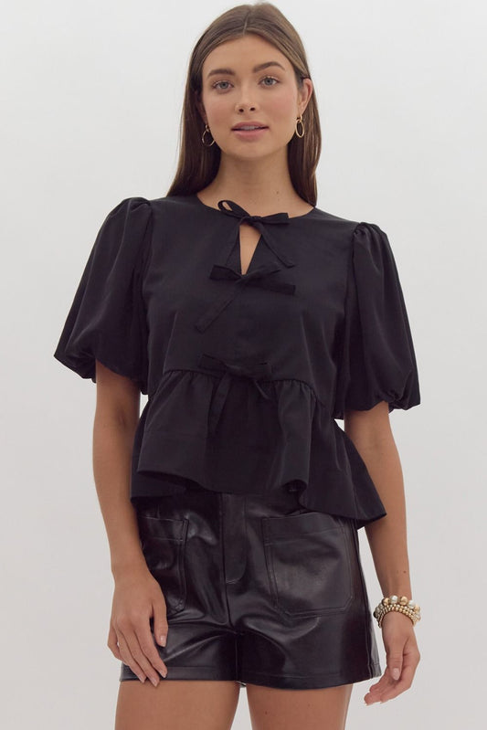 Black Solid short puff sleeve peplum top featuring self-tie bow detail at front