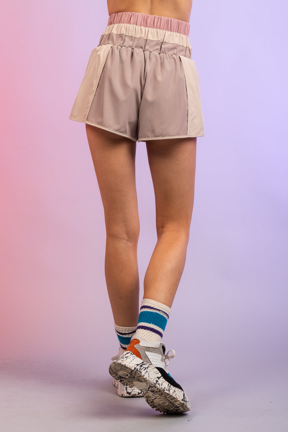 Color Blocked "Dolphin" Active Shorts
- Beige