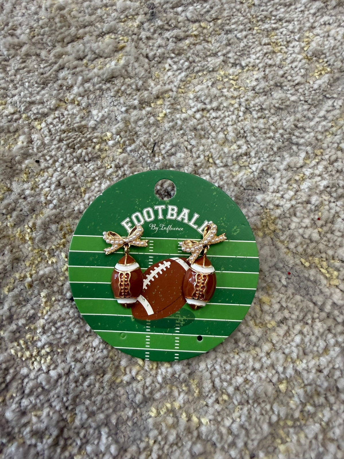 Glitter bow studs with football dangle