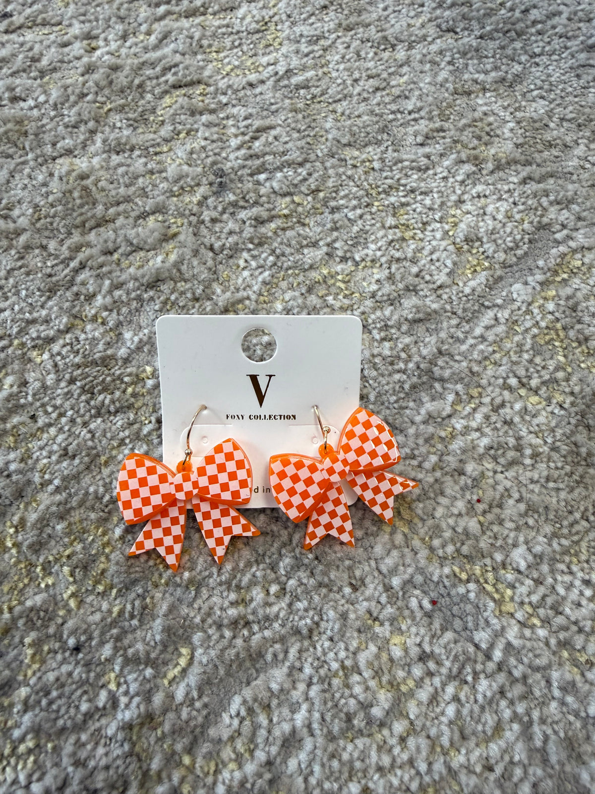 Orange and white checkered bow dangles
