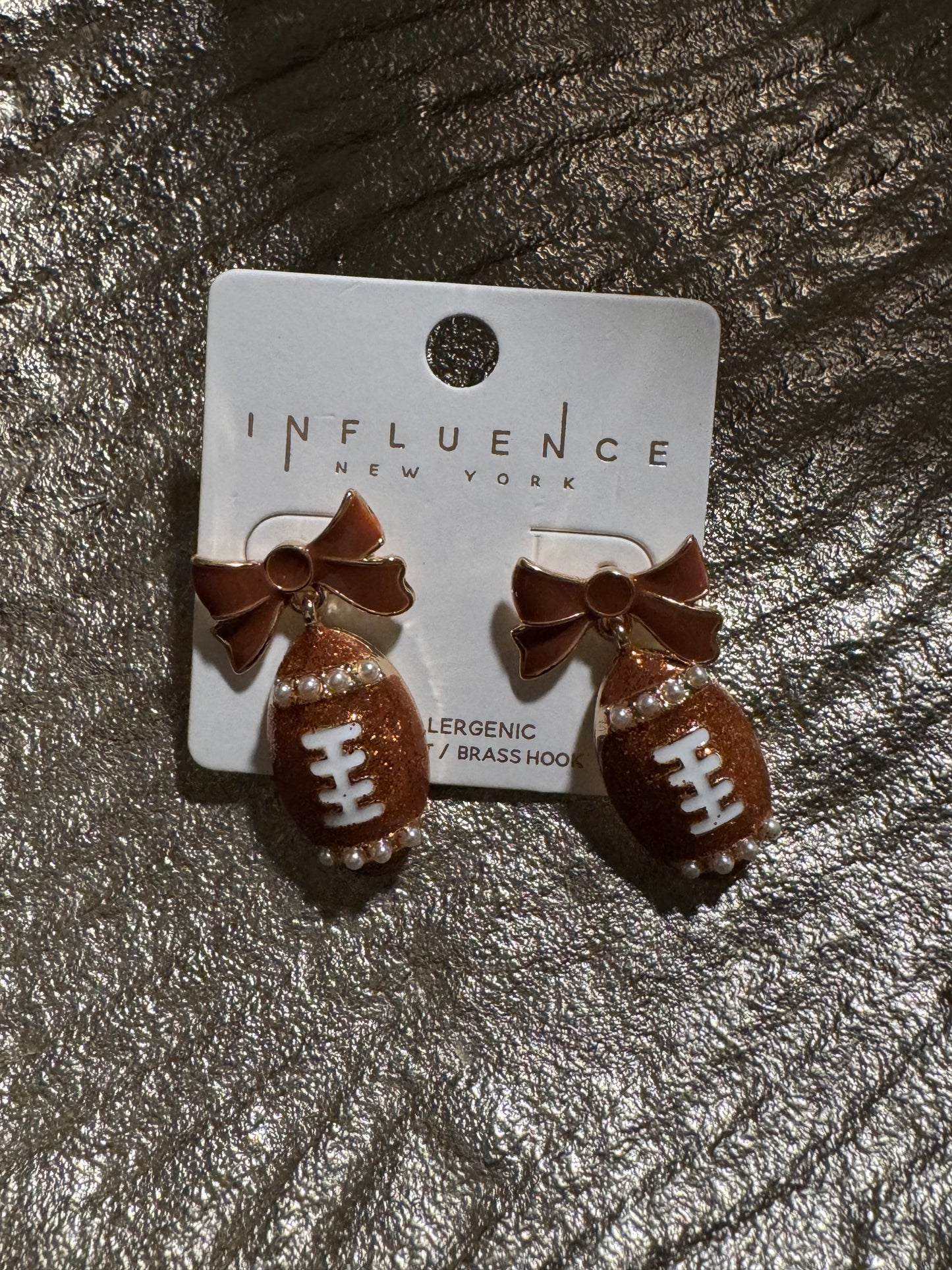 Football with brown bow earring