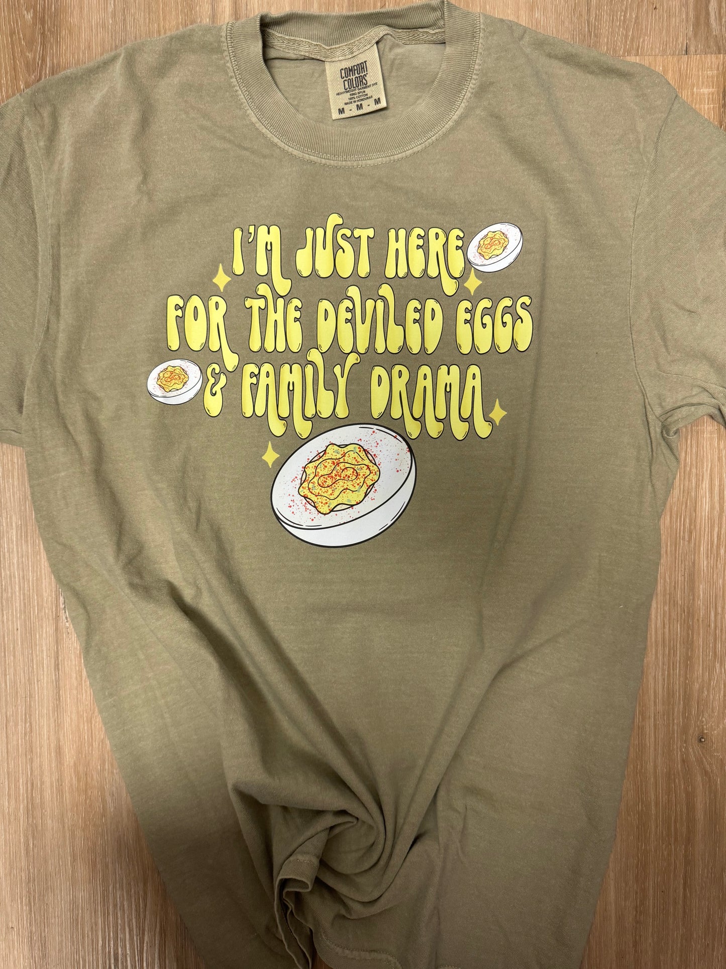 I’m just here for deviled eggs and family drama tee