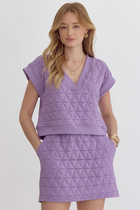 Textured v-neck short sleeve cropped top. Unlined. Knit. Non-sheer. Mediumweight. Lavender