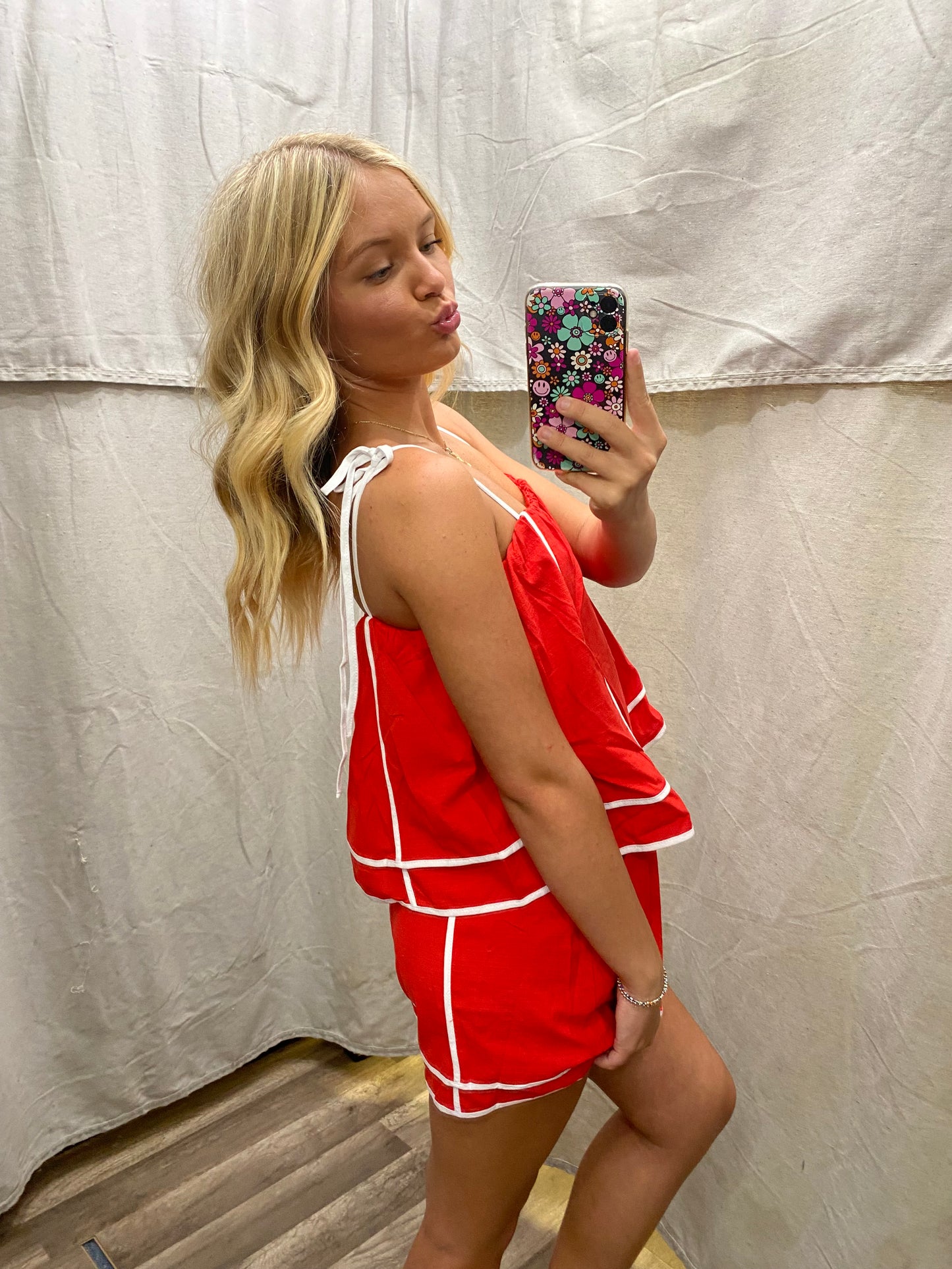 Red Solid shoulder tie pull-on romper featuring contrasting accented trim inset.