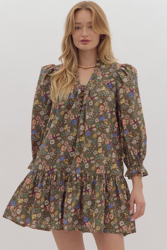 Floral pullover mini dress featuring elasticized ¾ puff sleeves.