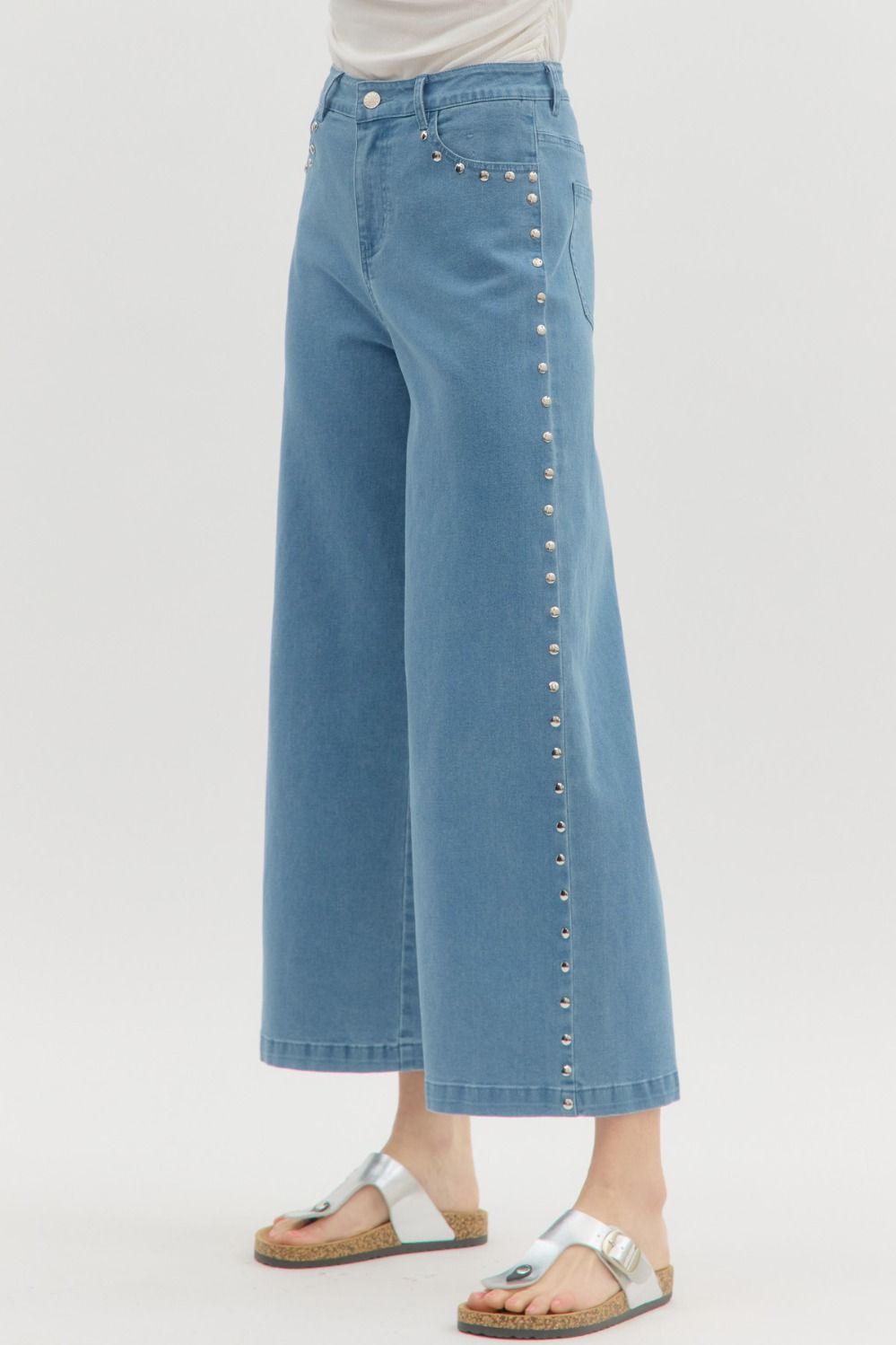 Solid high waist ankle-length pants featuring silver accented stud embellishments