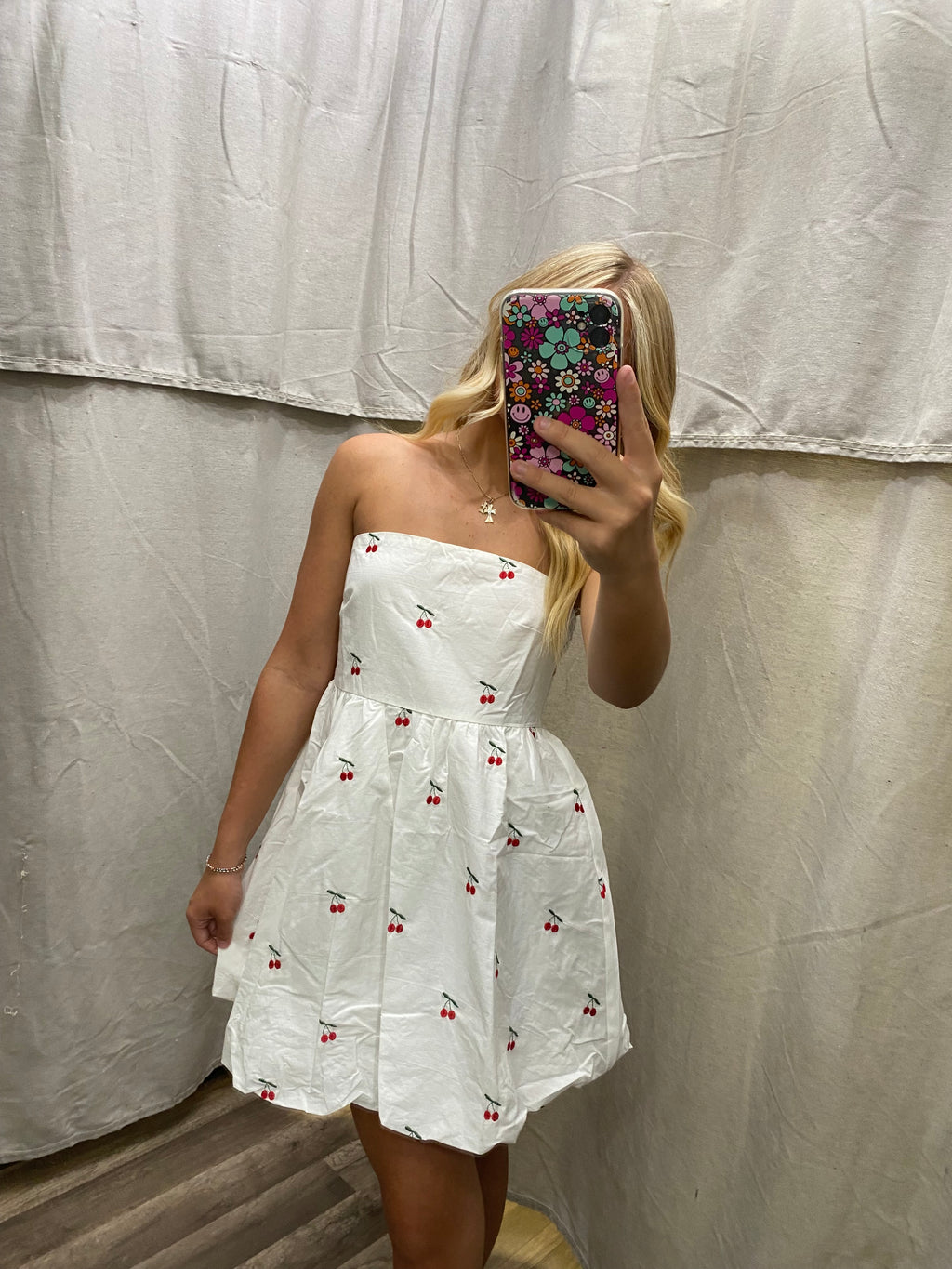 Strapless bubble hem cherry mini dress