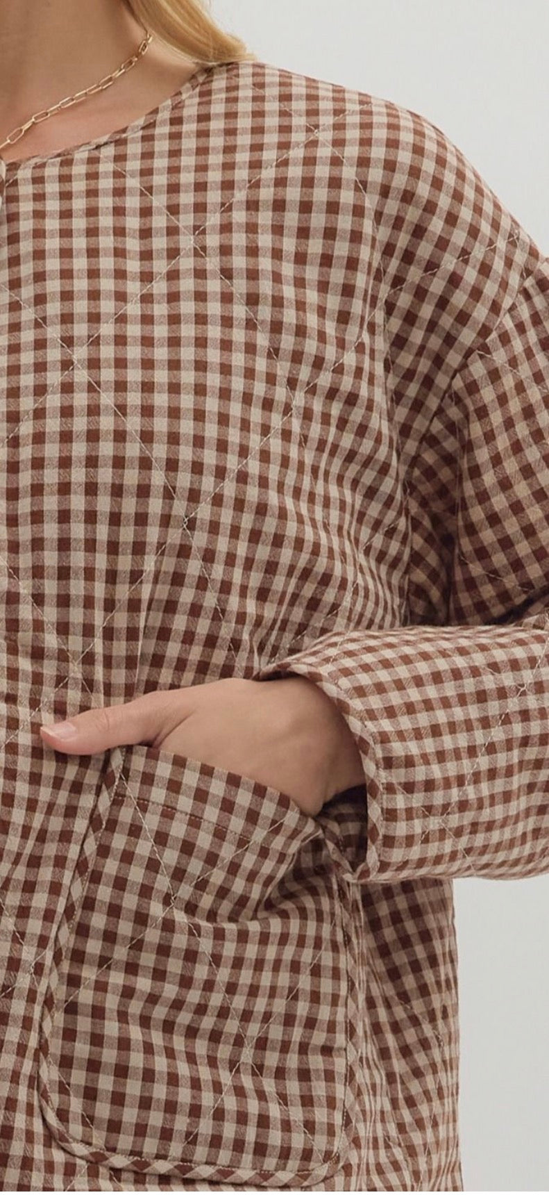 Gingham pattern long sleeve quilted jacket. Snap button closure with patch pockets at front- Chocolate