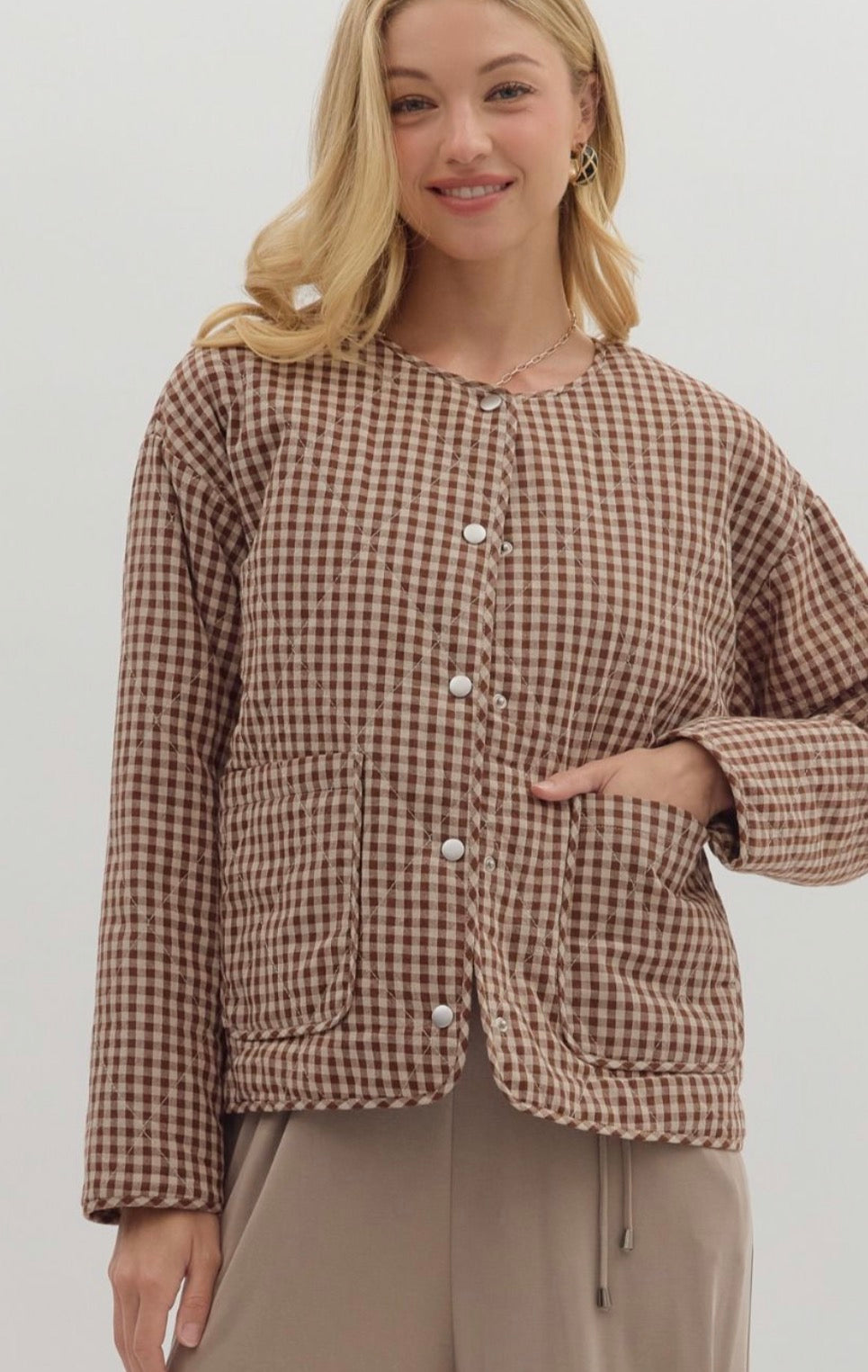 Gingham pattern long sleeve quilted jacket. Snap button closure with patch pockets at front- Chocolate