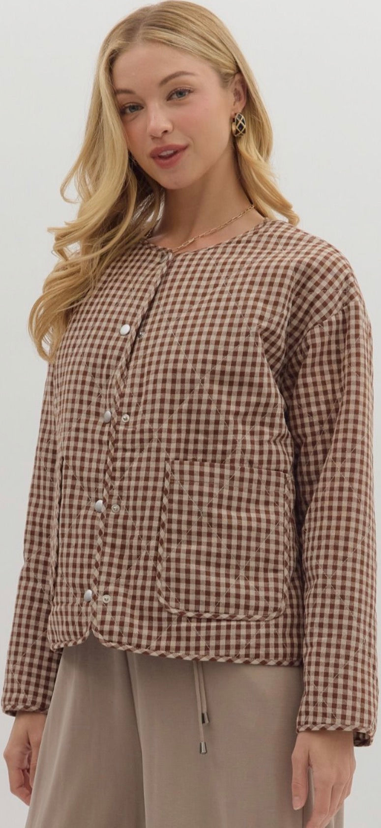 Gingham pattern long sleeve quilted jacket. Snap button closure with patch pockets at front- Chocolate