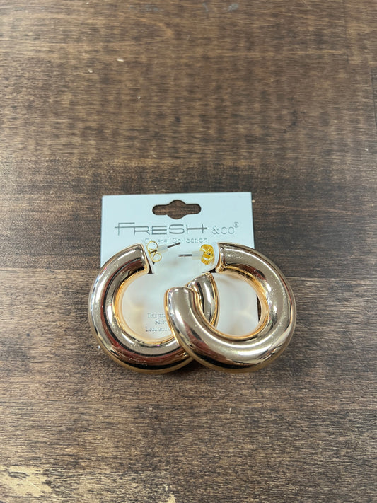 Thick gold hoop earrings