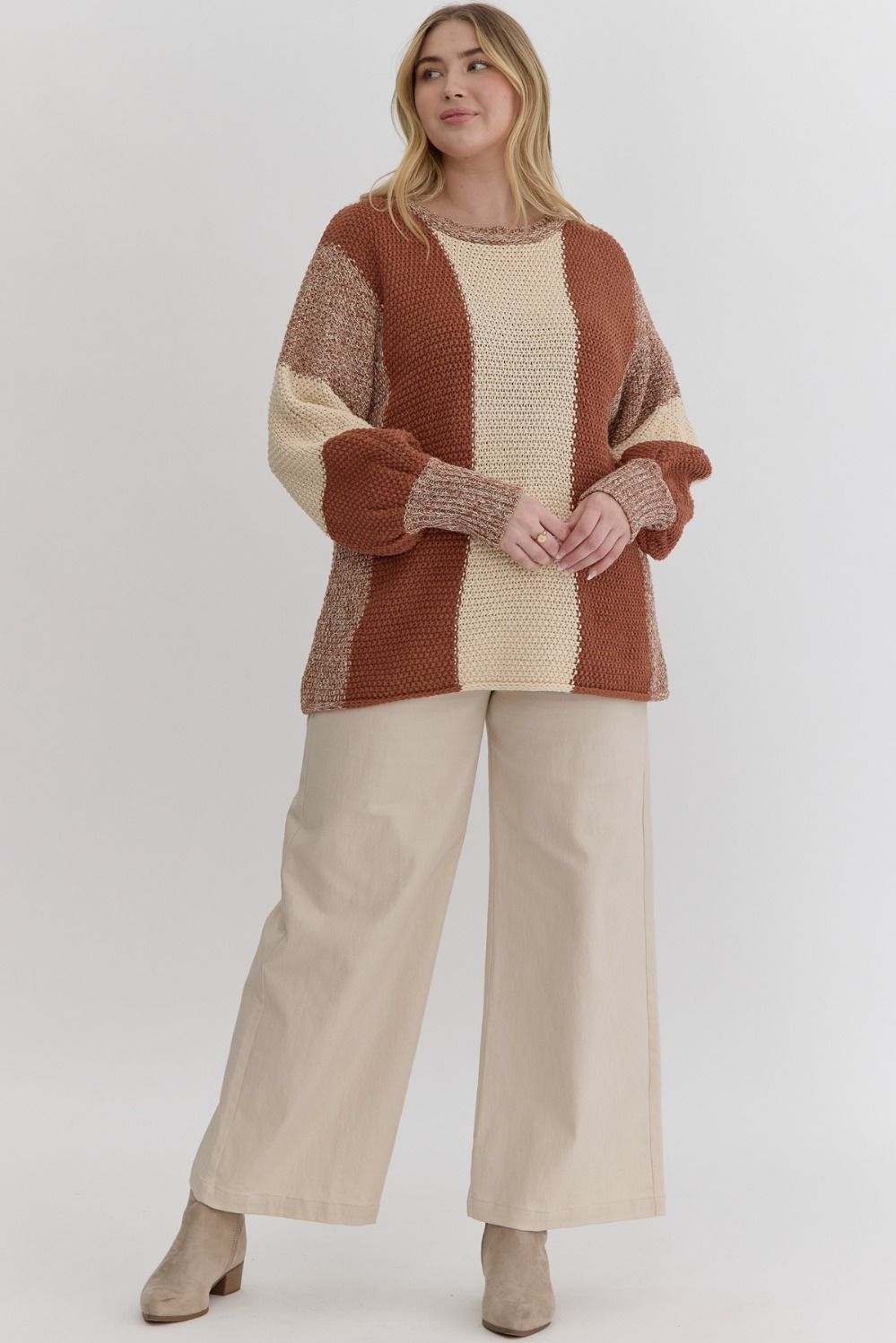 Colorblock knit cropped bubble sleeve sweater featuring ribbed cuffs.