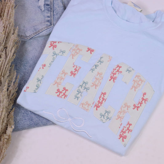 Teach Coquette Bow Appliqué Sleeve